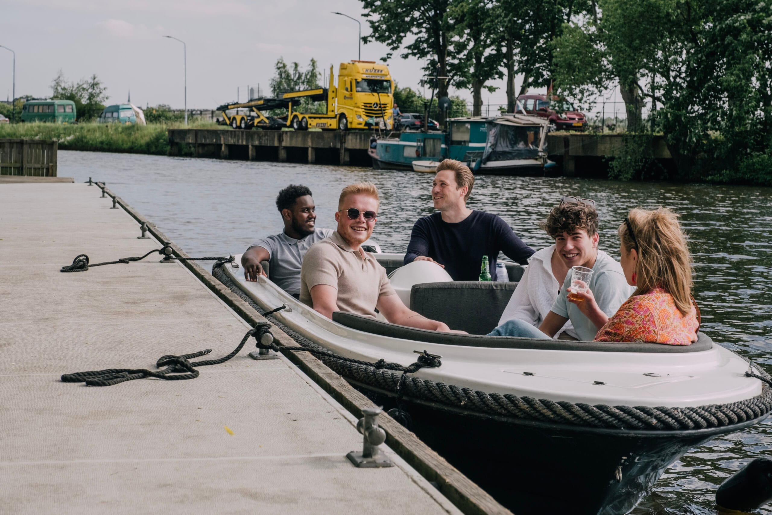 Team outing on the dock at Sloepverhuur Breda